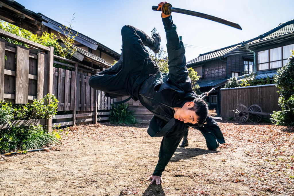 Henry Golding plays Snake Eyes in Snake Eyes: G.I. Joe Origins from Paramount Pictures, Metro-Goldwyn-Mayer Pictures, and Skydance.
