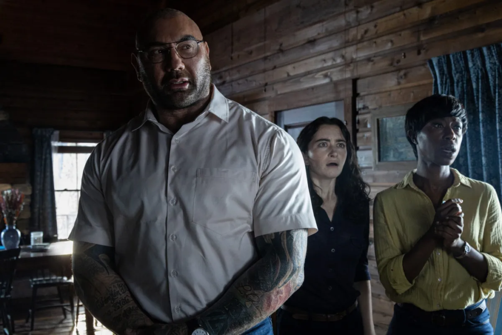 From left: Dave Bautista, Abby Quinn, and Nikki Amuka-Bird in “Knock at the Cabin” (Universal Pictures)
